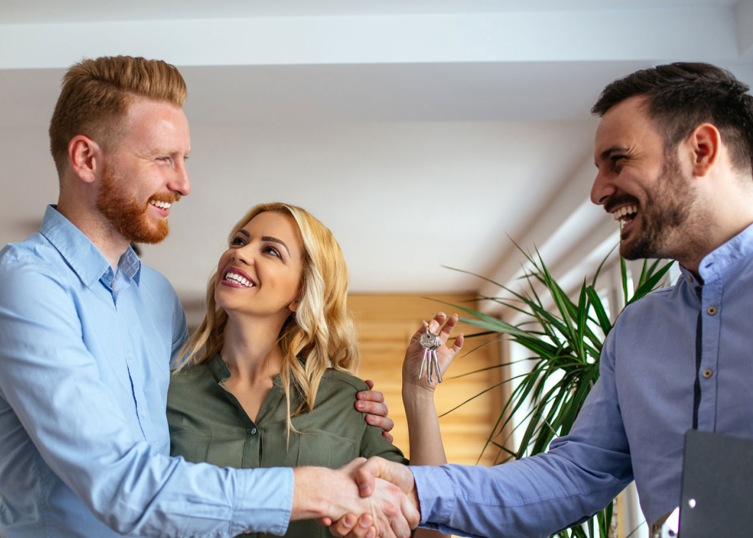 Handshake over a set of house keys