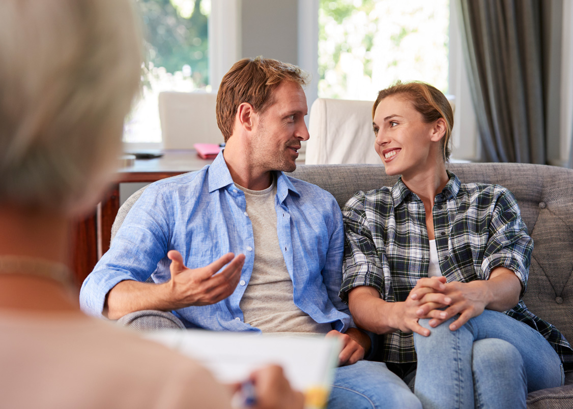 Happy young couple relaxing at home