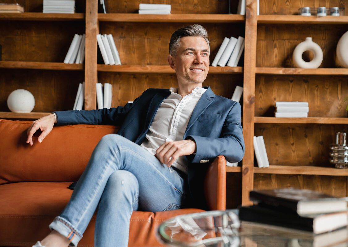 Man smiling while reviewing his retirement plan