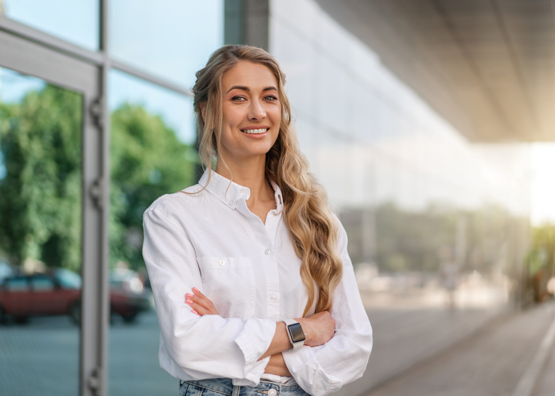 Confident businesswoman outside her office